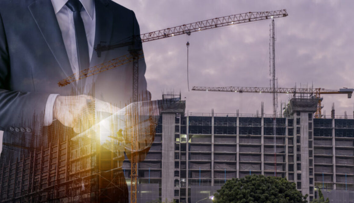 Double exposure image of construction worker with tablet compute